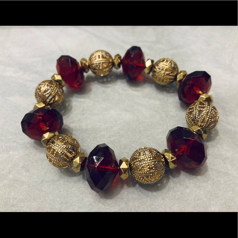 Red and gold tone stretch bracelet